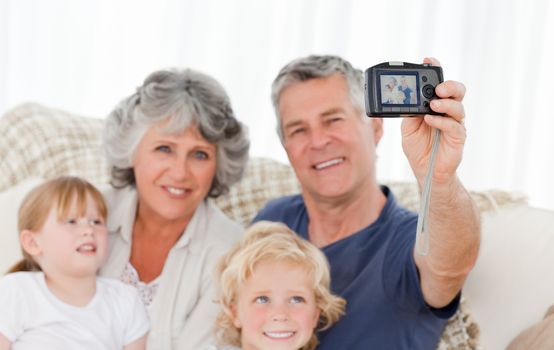 Family taking a photo of themselves at home