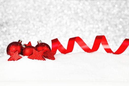 Beautiful red christmas decor on snow