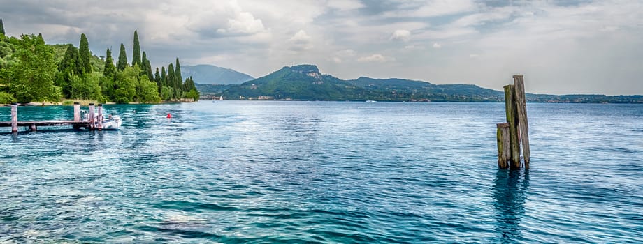 Scenic panoramic view over Lake Garda from Punta San Vigilio, Italy
