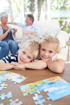 Children looking at the camera in the living room