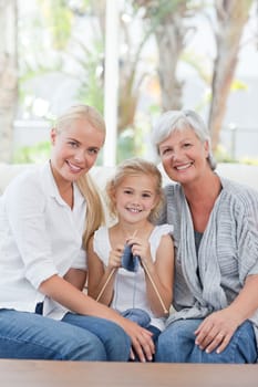 Beautiful family looking at the camera at home