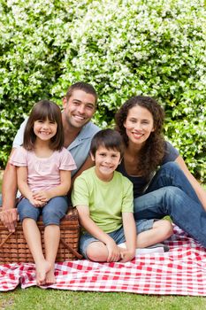 Family picnicking in the garden 