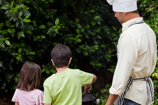 Family having a barbecue in the garden 