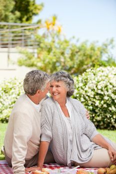 Woman looking at her husband in the garden