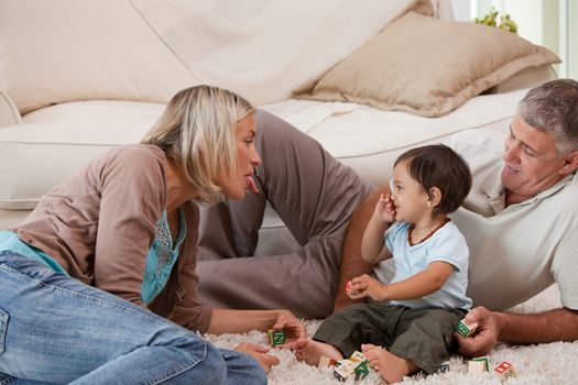 Son playing with his parents at home