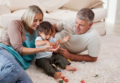 Son playing with his parents at home