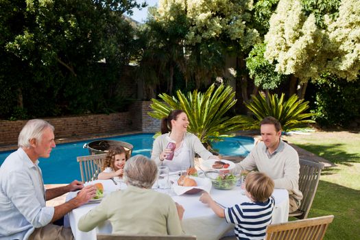 Family eating in the garden