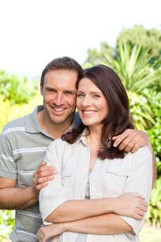 Beautiful woman with her husband in the garden