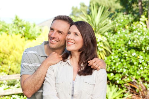 Beautiful woman with her husband in the garden