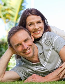 Couple lying down in the garden