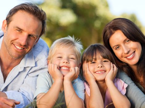 Family lying down in the park