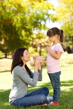 Beautiful mother with her daughter in the park