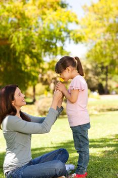 Beautiful mother with her daughter in the park