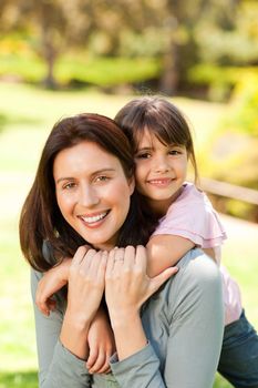 Happy mother with her daughter in the park