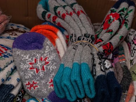 A pile of warm wool socks. winter comfort, winter inspiration, still life. A stack of knitted wool colorful socks