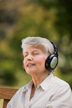 Elderly woman listening to some music