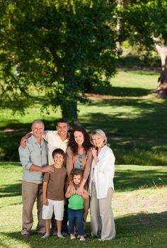 Family looking at the camera in the park