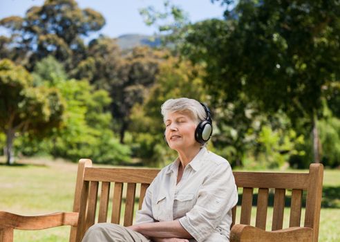 Elderly woman listening to some music