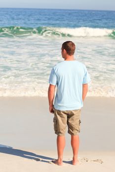 Handsome man looking at the sea