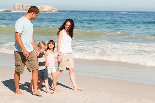 Family walking on the beach