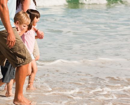 Family walking on the beach