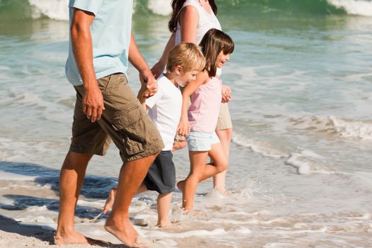 Family walking on the beach