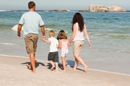 Family walking on the beach