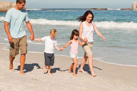 Family walking on the beach