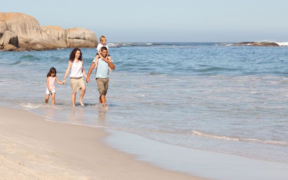 Joyful family at the beach