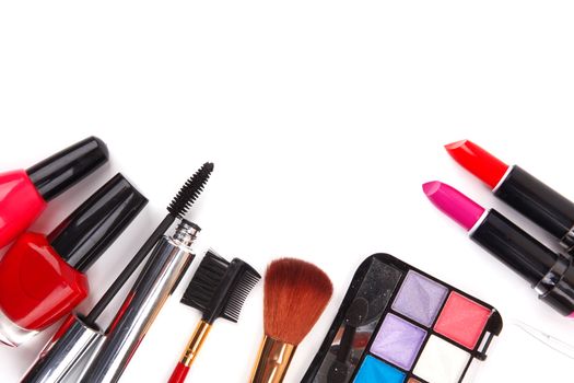 makeup brush and cosmetics on white background
