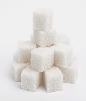 Cubes of sugar on the white background