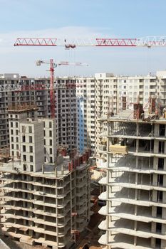 construction site with crane and building