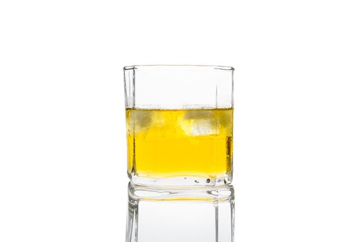 Glass of whisky on white background