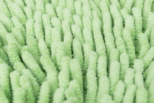 Macro green cleaning doormat or carpet for background