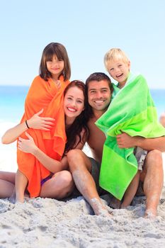 Parents with their children in towels