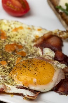 two eggs sunny side up on a plate