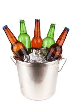 beer bottles in a bucket of ice isolated on a white background.