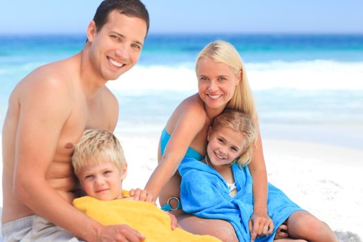 Parents with their children in their towels