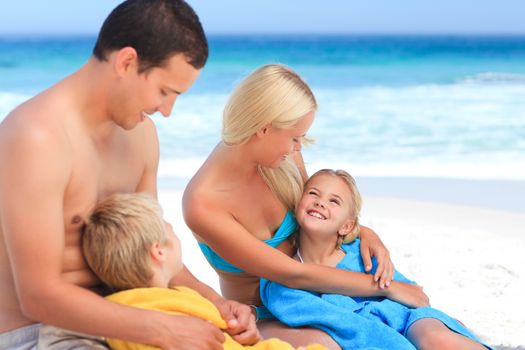 Parents with their children in their towels