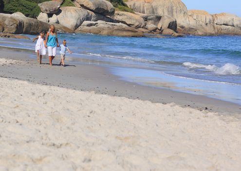 Family walking on the beach