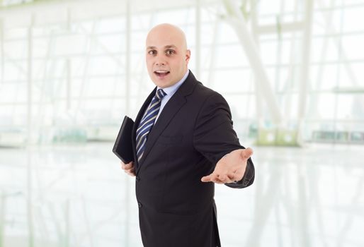 proud businessman with a tablet pc, at the office