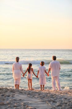 Portrait of a family beside the sea