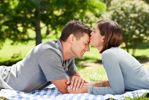 Enamored couple in the park during the summer