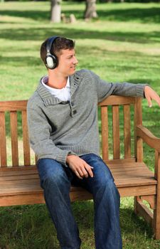 Relaxed man listening to some music during the summer