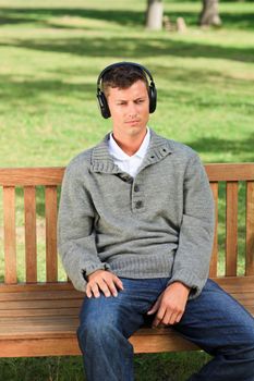 Relaxed man listening to some music during the summer