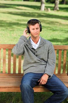 Relaxed man listening to some music during the summer