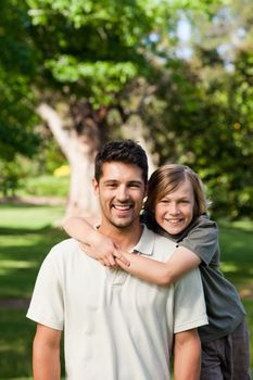 Father and his son in the park during the summer