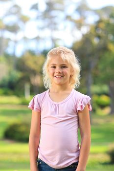 Little girl in the park during the summer