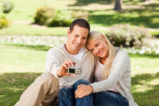 Young couple taking a photo of themselves during the summer 