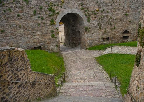 Big stone walls and gate at Dinan fortress, France